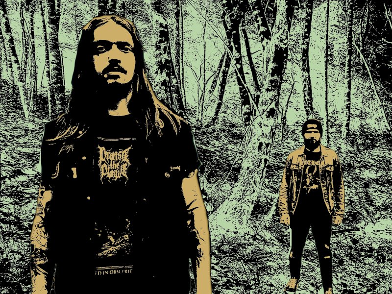 The band Goblinsmoker stood in a forest wearing denim battle jackets